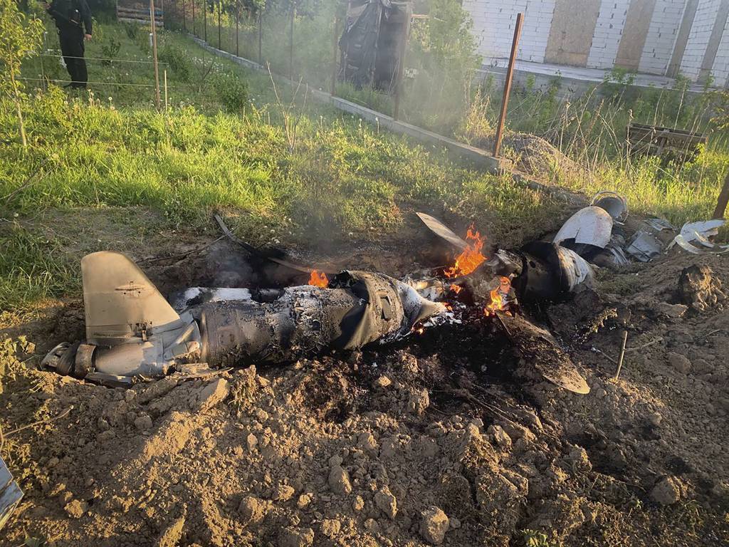 In this photo provided by the Ukrainian Police Press Office, fragments of a Russian rocket which was shot down by Ukraine's air defence system are seen after the night rocket attack in the Kyiv region, Ukraine, Thursday, May 18, 2023.